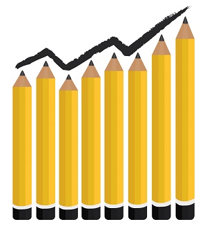 pencils a freelance writer uses set against an increasing graph