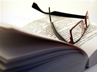 glasses on an open book